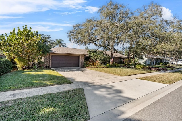 view of front of house featuring a front lawn and a garage