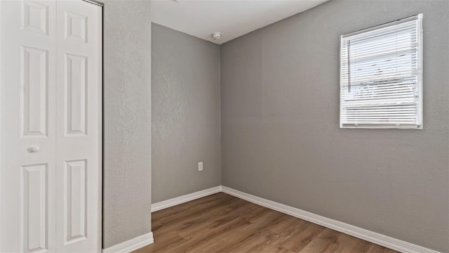 empty room featuring hardwood / wood-style flooring