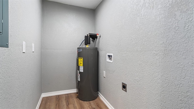 utility room featuring electric water heater