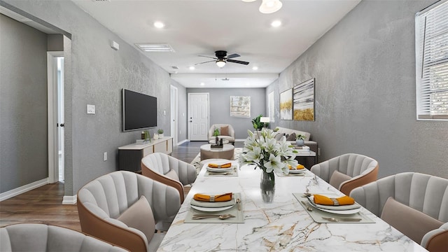 dining space featuring hardwood / wood-style flooring and ceiling fan