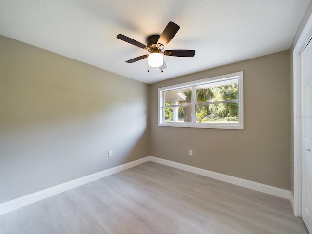 unfurnished bedroom featuring ceiling fan and light hardwood / wood-style floors