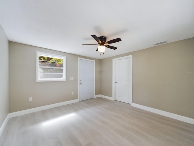 spare room with ceiling fan and light hardwood / wood-style floors