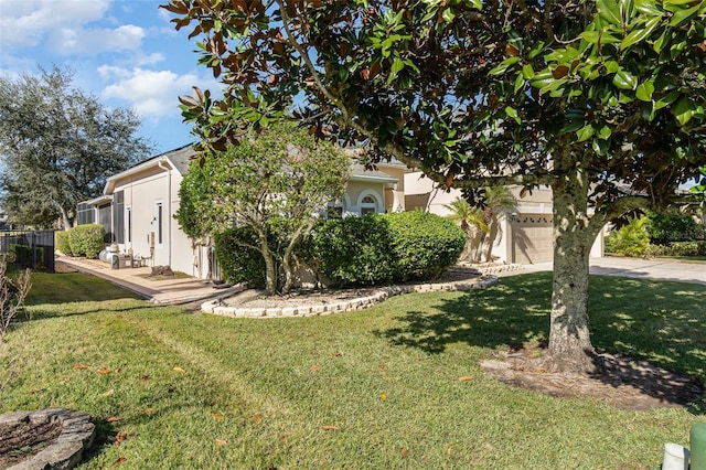 view of property hidden behind natural elements with a front lawn