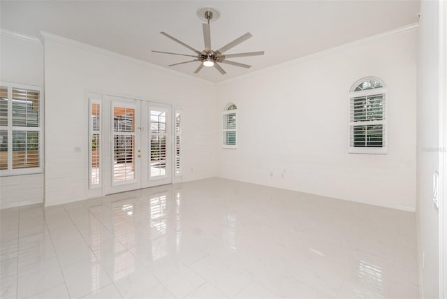 tiled empty room featuring ceiling fan, ornamental molding, and french doors