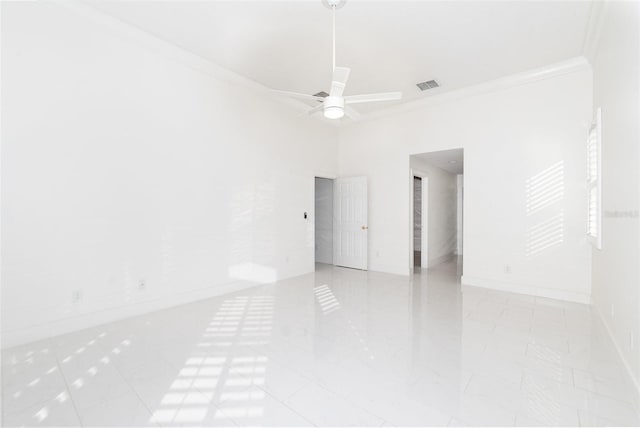 empty room with ceiling fan and crown molding