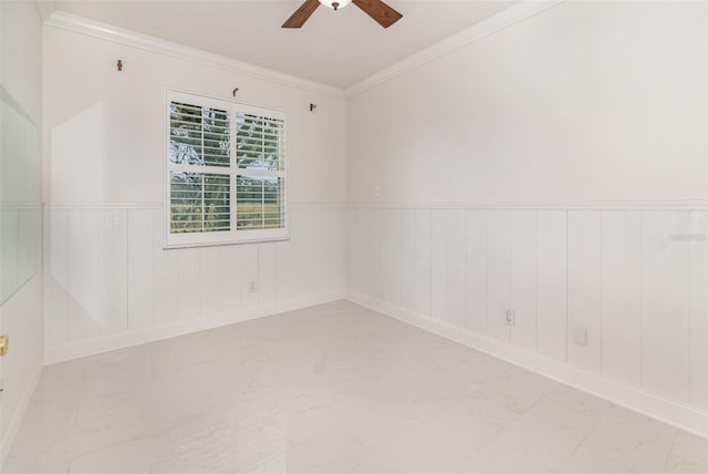 spare room with crown molding and ceiling fan