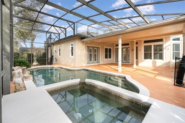 view of swimming pool featuring a lanai, an in ground hot tub, french doors, and a patio