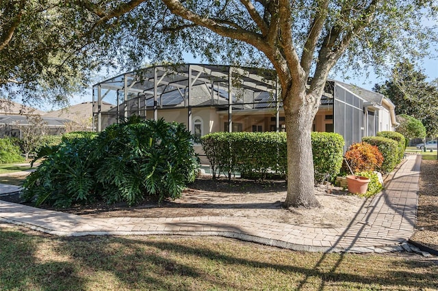 view of yard featuring a lanai