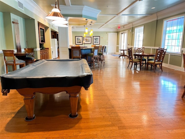 playroom featuring light hardwood / wood-style floors, crown molding, coffered ceiling, and billiards