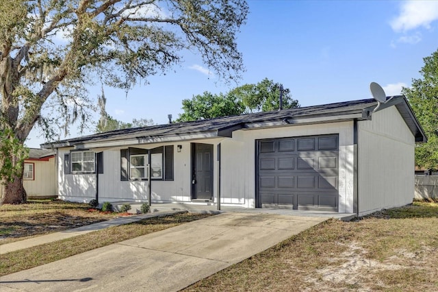 ranch-style home featuring a porch and a garage