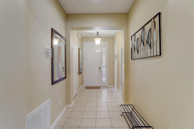 entryway featuring light tile patterned floors