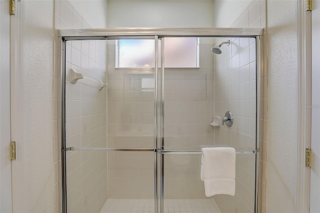 bathroom with an enclosed shower