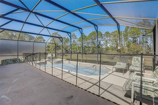 view of pool featuring an in ground hot tub, a lanai, and a patio area