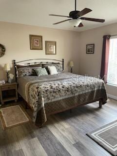 bedroom featuring ceiling fan and wood-type flooring