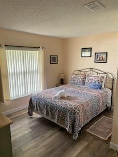 bedroom featuring dark hardwood / wood-style flooring