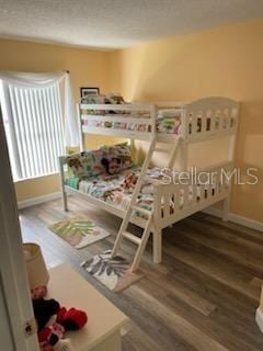 bedroom featuring hardwood / wood-style floors