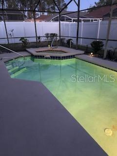 view of pool with a lanai