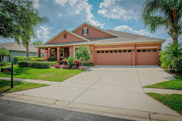 view of front facade featuring a garage and a front lawn