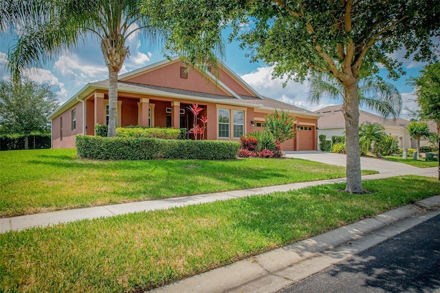 view of front of house featuring a front yard and a garage