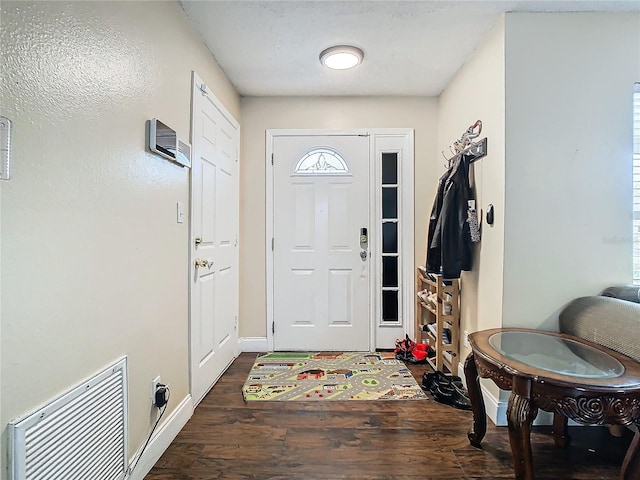 foyer entrance featuring dark hardwood / wood-style flooring