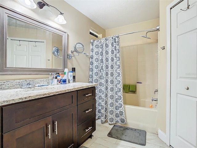 bathroom with vanity, tile patterned floors, and shower / bath combo with shower curtain