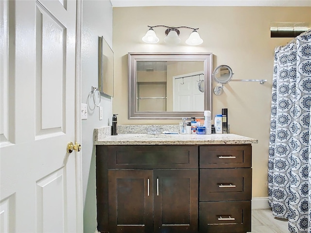 bathroom with tile patterned flooring and vanity