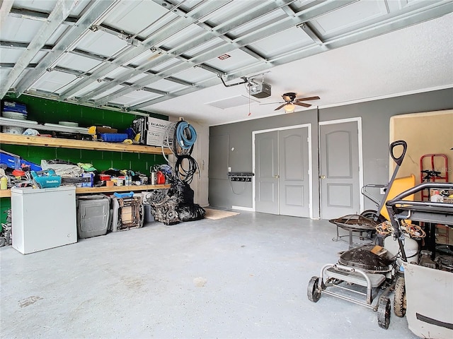 garage featuring ceiling fan and a garage door opener