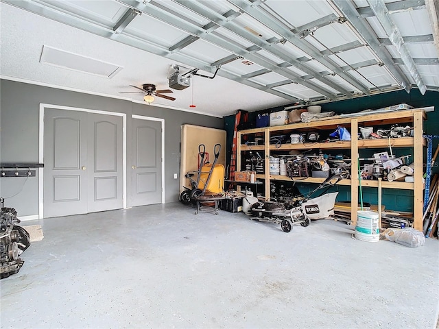 garage featuring a garage door opener and ceiling fan