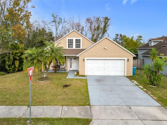 view of front of house with a garage and a front yard