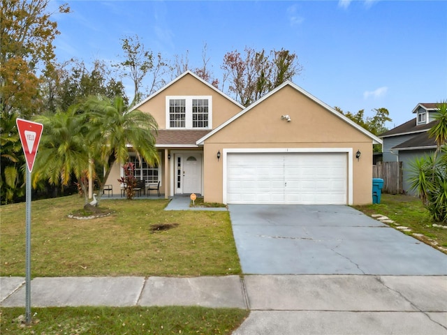 view of front of property with a garage and a front lawn