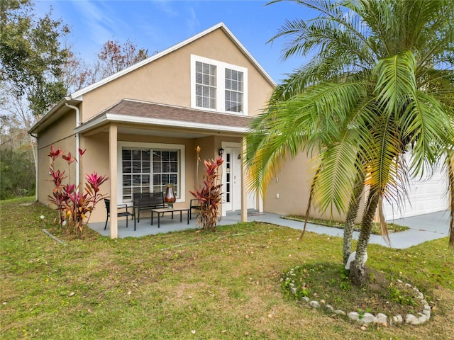 view of front of home featuring a garage and a front yard