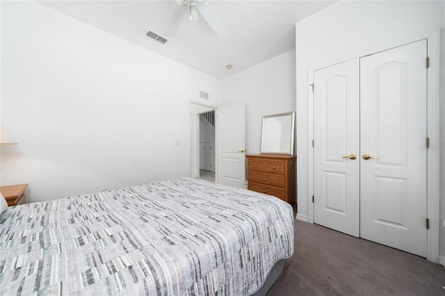 carpeted bedroom featuring a closet and ceiling fan