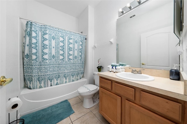 full bathroom with tile patterned floors, vanity, toilet, and shower / bath combo with shower curtain