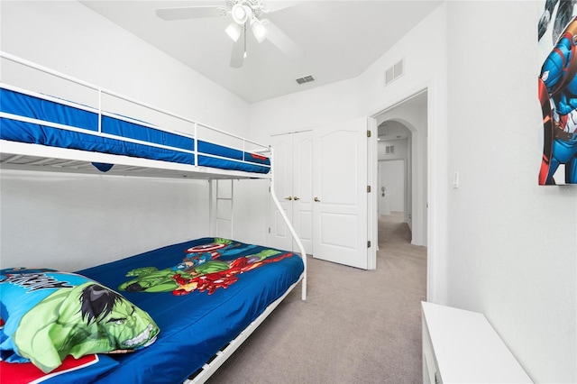 bedroom featuring carpet flooring, a closet, and ceiling fan