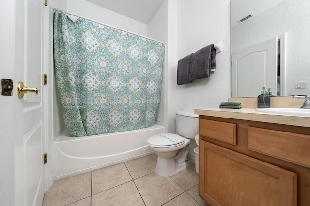 full bathroom with tile patterned floors, vanity, toilet, and shower / bath combo with shower curtain