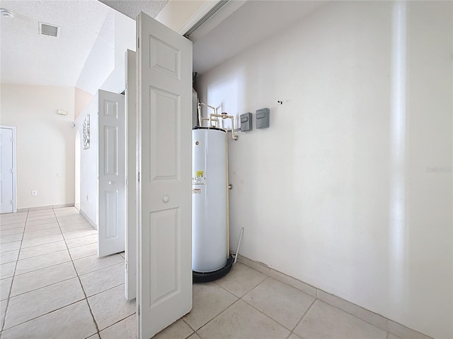 utility room featuring gas water heater