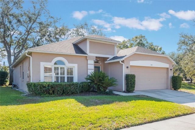 view of front of house featuring a front yard and a garage