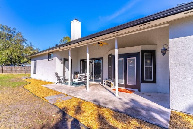 back of house featuring a patio area and ceiling fan