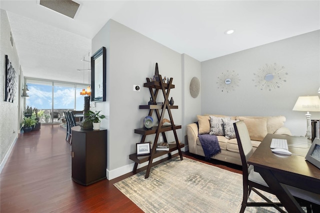 bedroom with dark hardwood / wood-style flooring and expansive windows