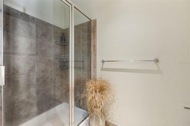 bathroom with a shower with shower door