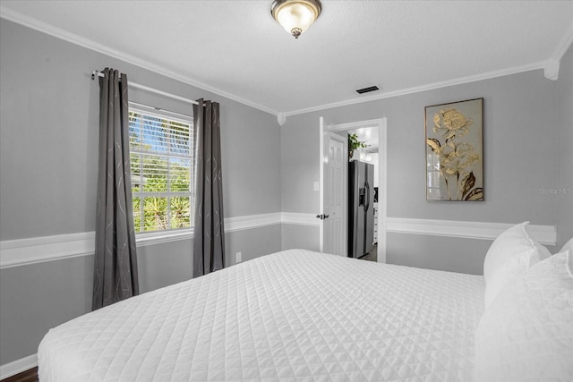 bedroom with crown molding