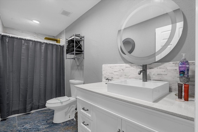 bathroom featuring tasteful backsplash, vanity, curtained shower, and toilet