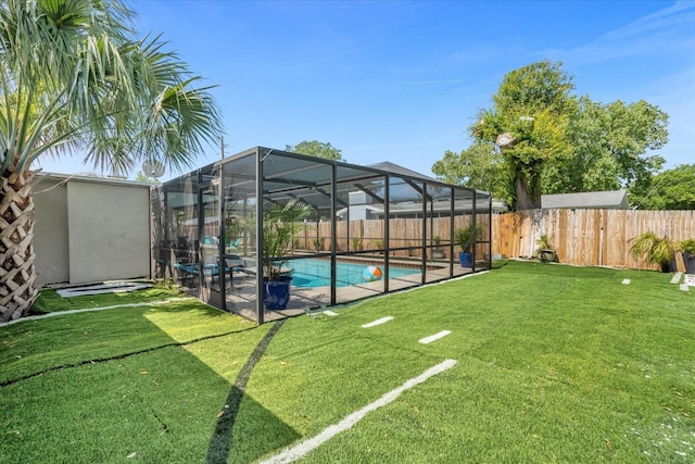 view of yard featuring a fenced in pool and a lanai