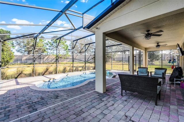 view of patio with an outdoor hangout area, ceiling fan, glass enclosure, and a fenced in pool