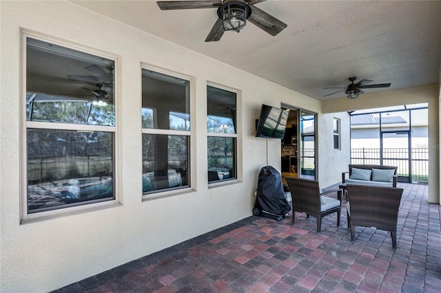 view of patio featuring ceiling fan and an outdoor living space