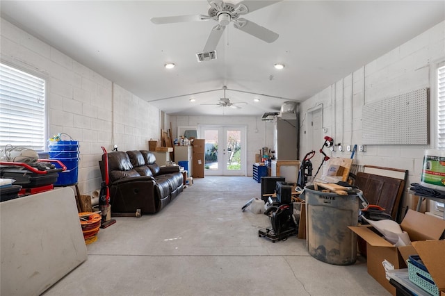 garage featuring concrete block wall, recessed lighting, visible vents, and french doors