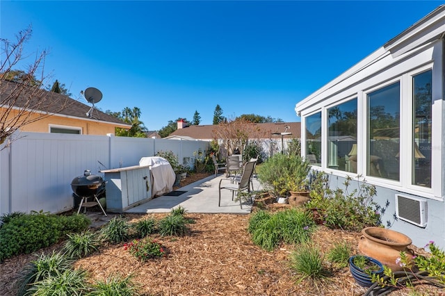 view of yard featuring a patio area and a fenced backyard