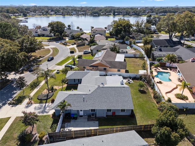 bird's eye view featuring a water view and a residential view