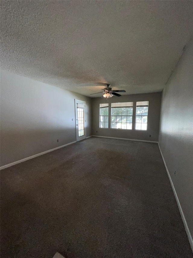 spare room featuring ceiling fan and a textured ceiling