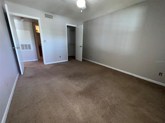 unfurnished bedroom featuring carpet flooring and ceiling fan